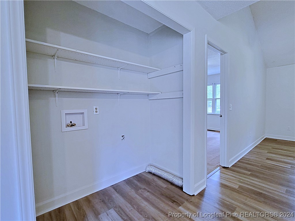210 Cypress Road Cameron, NC 28326 - Photo 10 of 50 a view of a hallway with wooden floor and closet
