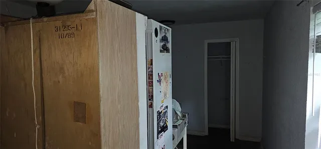 a bathroom with a granite countertop shower and a mirror