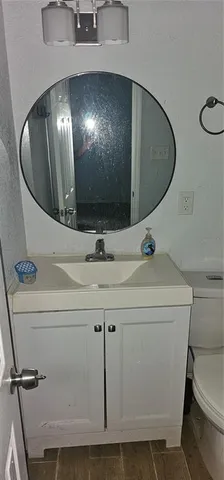 a view of a bathroom with a sink and mirror
