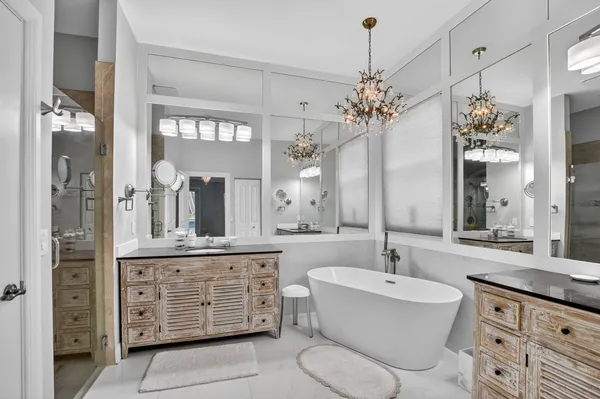 a white bath tub sitting next to a white sink