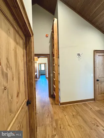 a kitchen with a sink a counter top space stainless steel appliances and cabinets