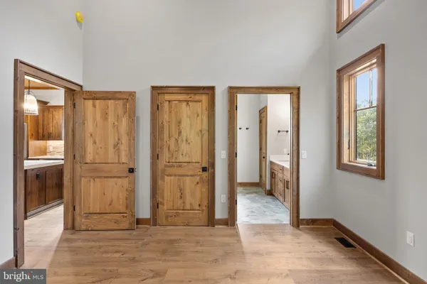 a bathroom with a double vanity sink and mirror