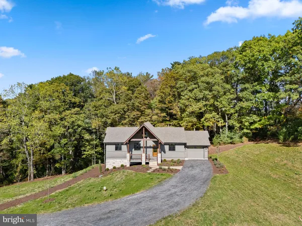 a view of a house with a big yard