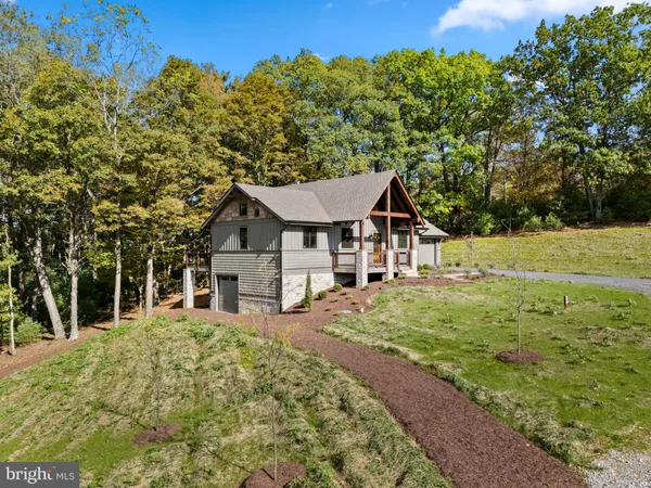a house with trees in the background