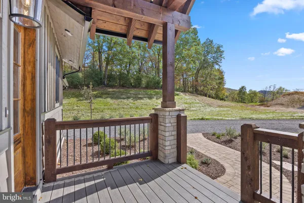 a view of a balcony with wooden floor
