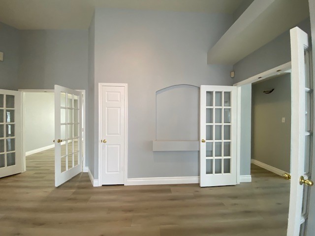 1512 Lorson Loop Round Rock, TX 78665 - Photo 5 of 29 an empty room with wooden floor and windows