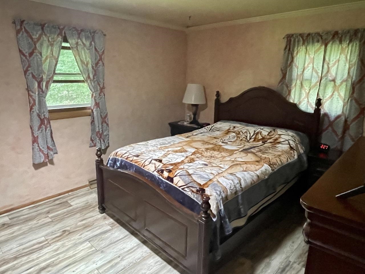 6840 Best Road Pecatonica, IL 61063 - Photo 13 of 29 a bedroom with a bed and a window