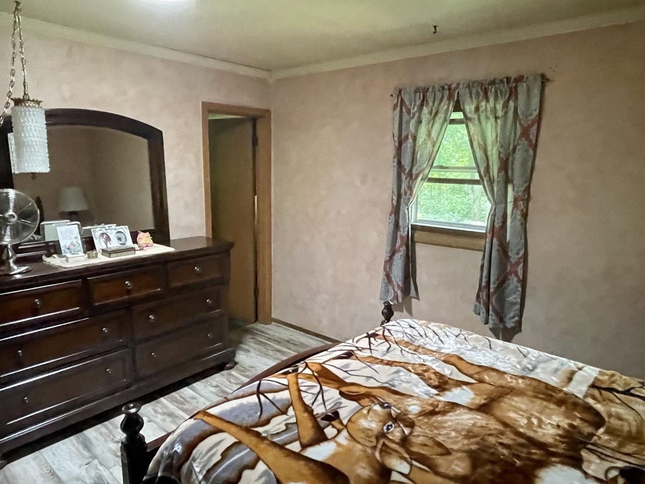 6840 Best Road Pecatonica, IL 61063 - Photo 14 of 29 a bedroom with a bed and a dresser