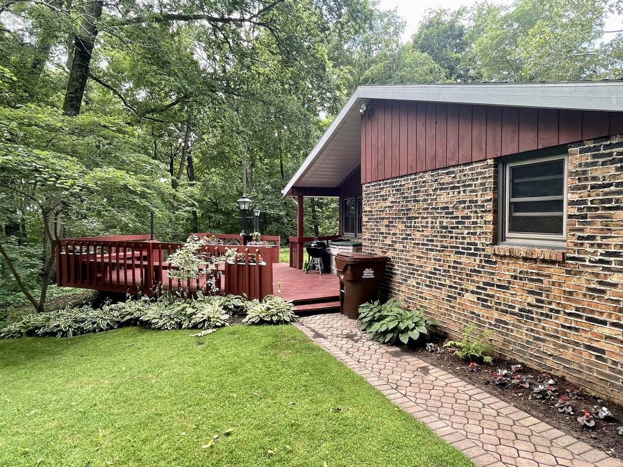 6840 Best Road Pecatonica, IL 61063 - Photo 19 of 29 a brick building with a yard