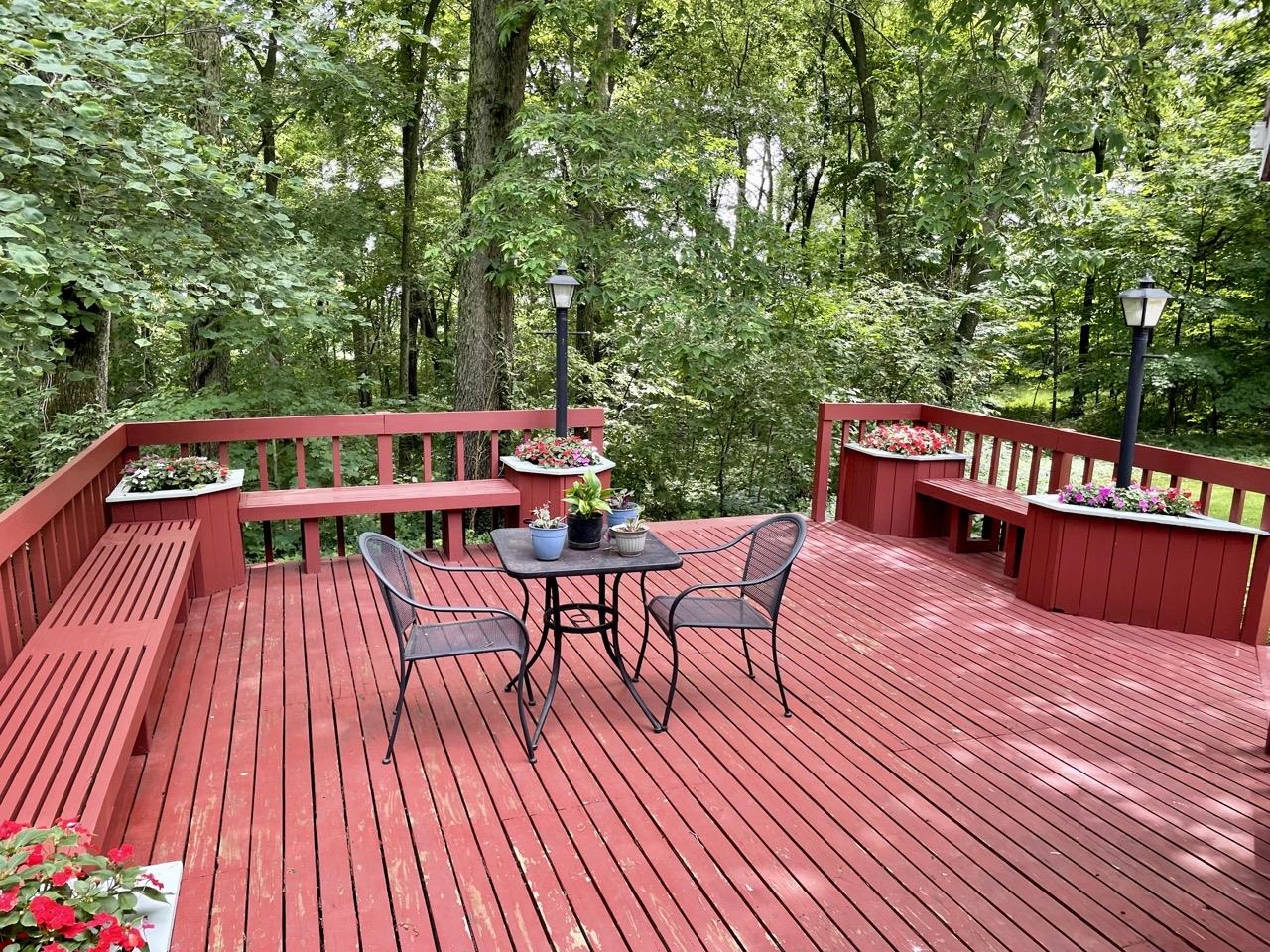 6840 Best Road Pecatonica, IL 61063 - Photo 20 of 29 a balcony with wooden floor table and chairs