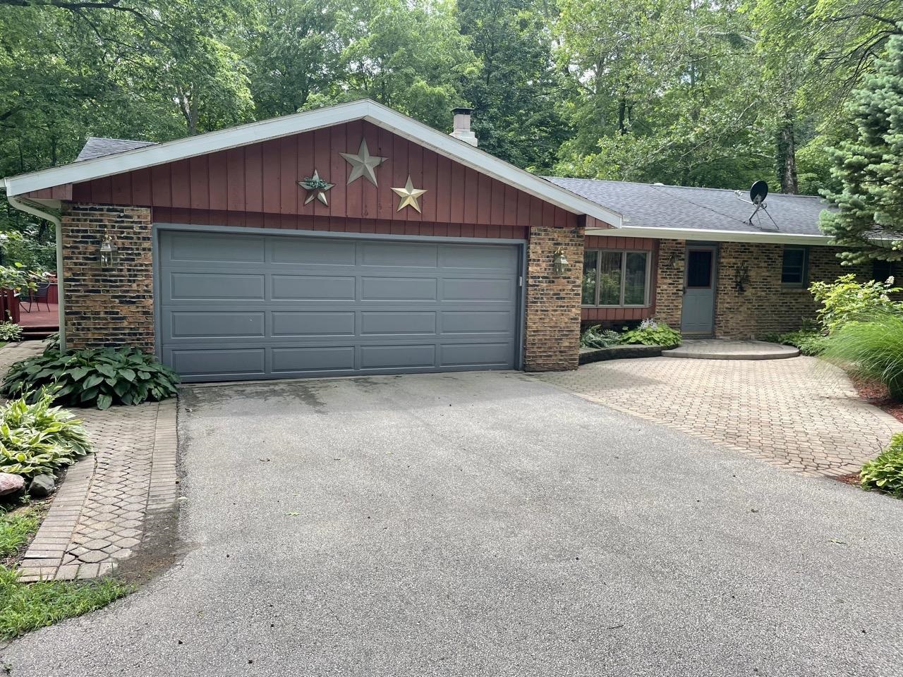 6840 Best Road Pecatonica, IL 61063 - Photo 2 of 29 a front view of a house with a garage