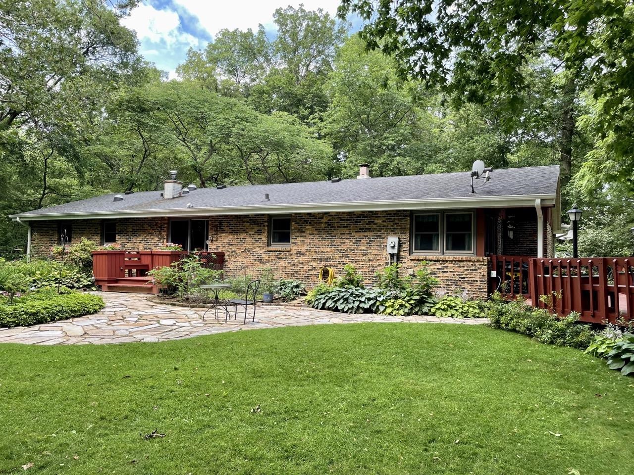 6840 Best Road Pecatonica, IL 61063 - Photo 23 of 29 a view of a house with a yard and sitting area