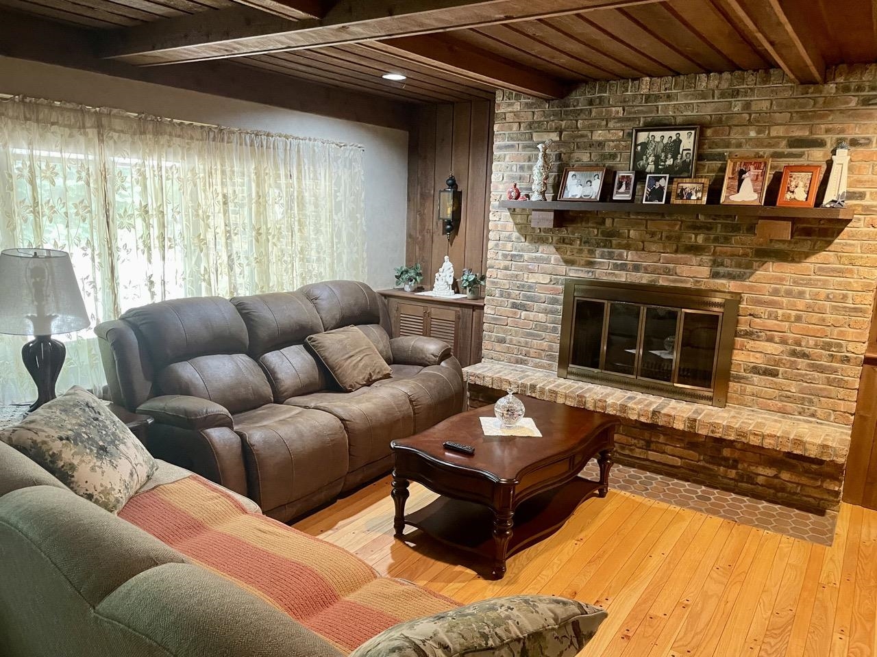 6840 Best Road Pecatonica, IL 61063 - Photo 4 of 29 a living room with furniture and a fireplace