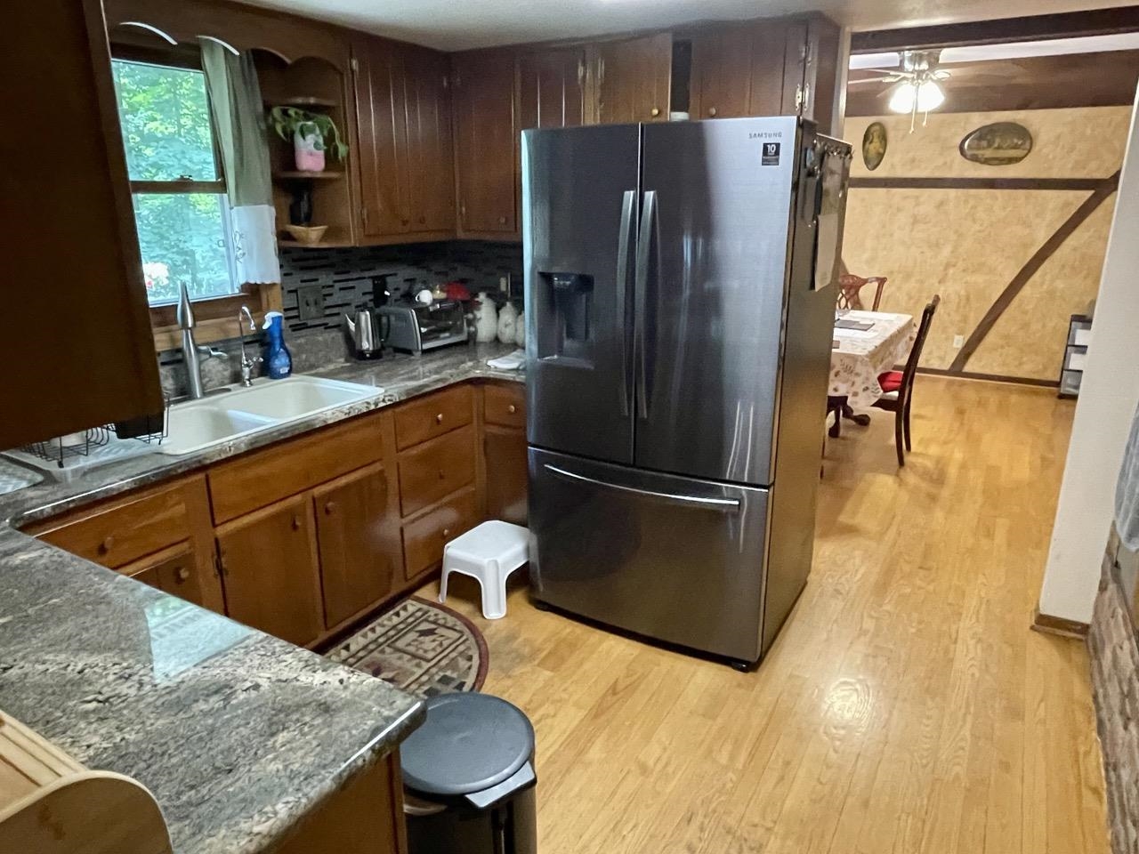 6840 Best Road Pecatonica, IL 61063 - Photo 8 of 29 a kitchen with stainless steel appliances granite countertop a refrigerator a sink and a stove