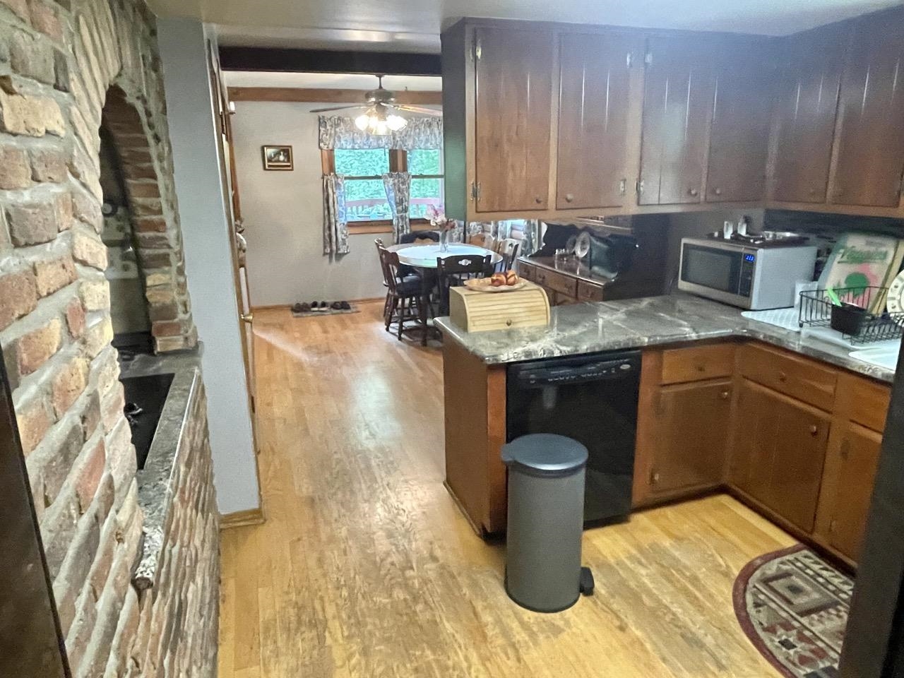 6840 Best Road Pecatonica, IL 61063 - Photo 9 of 29 a kitchen with a sink and a stove top oven