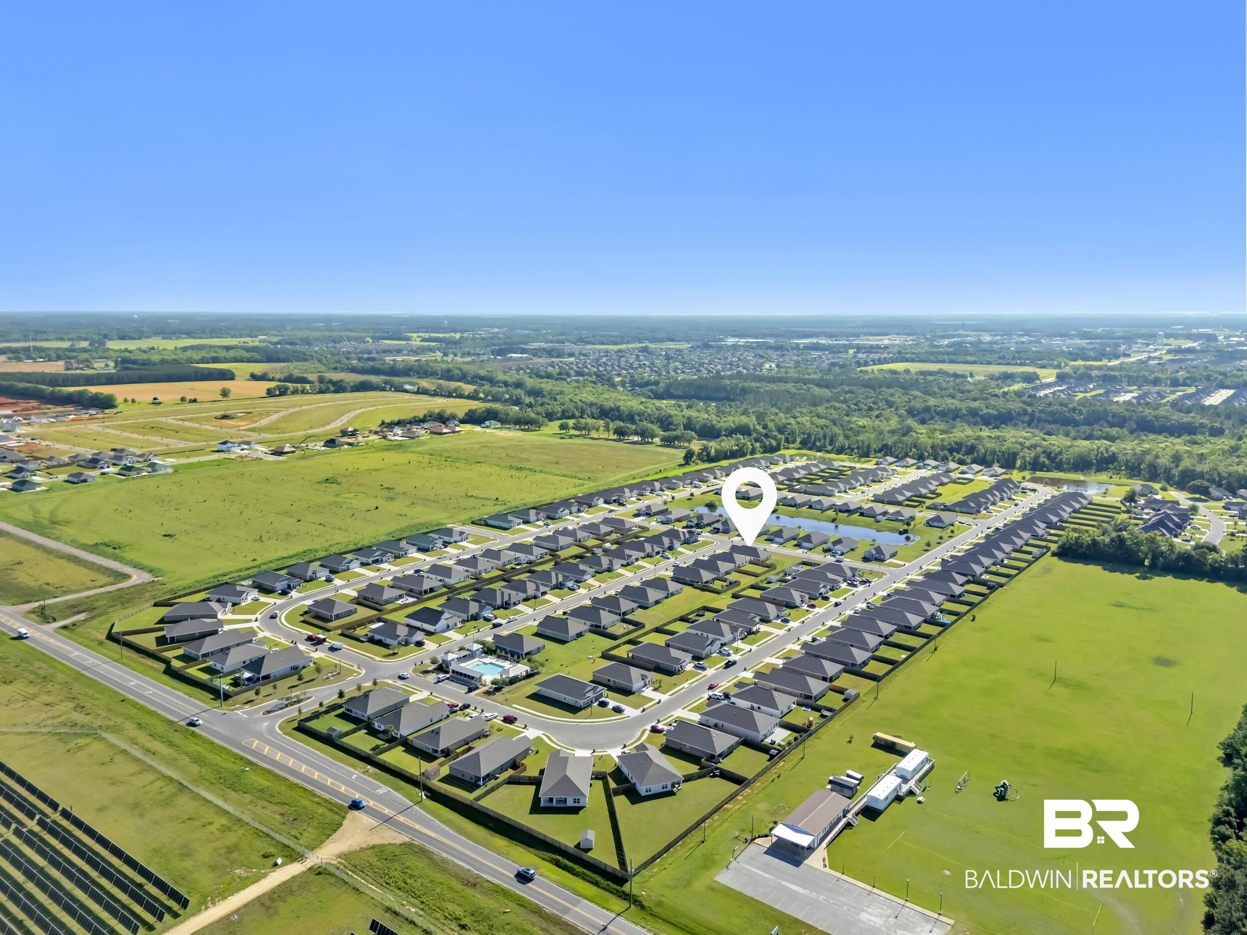 1228 Caper Avenue Foley, AL 36535 - Photo 51 of 54 Aerial perspective showcasing a residential community with uniform architectural styles