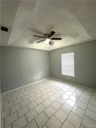 a view of an empty room and a window