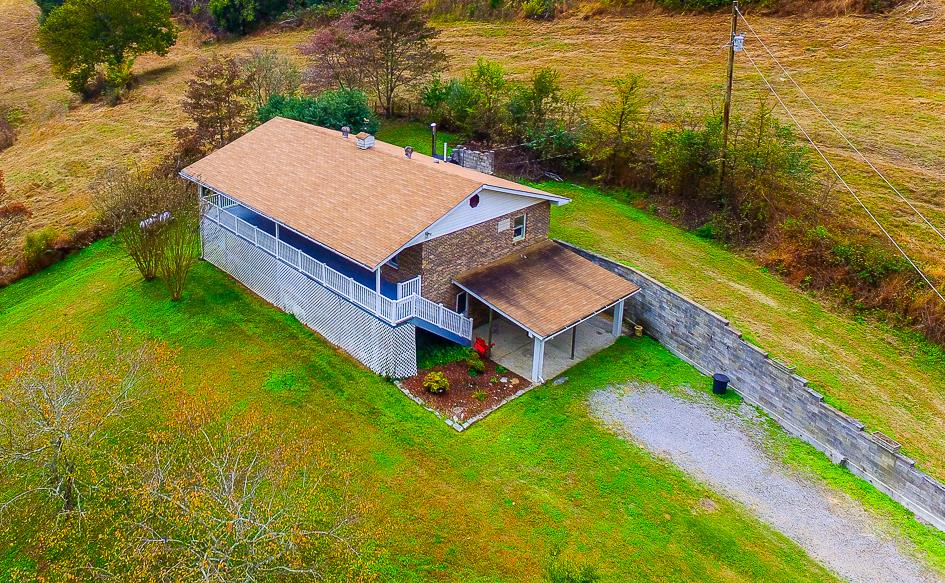 68 Taylor Road Mulberry, TN 37359 - Photo 1 of 24 a view of a backyard with lawn chairs and swimming pool