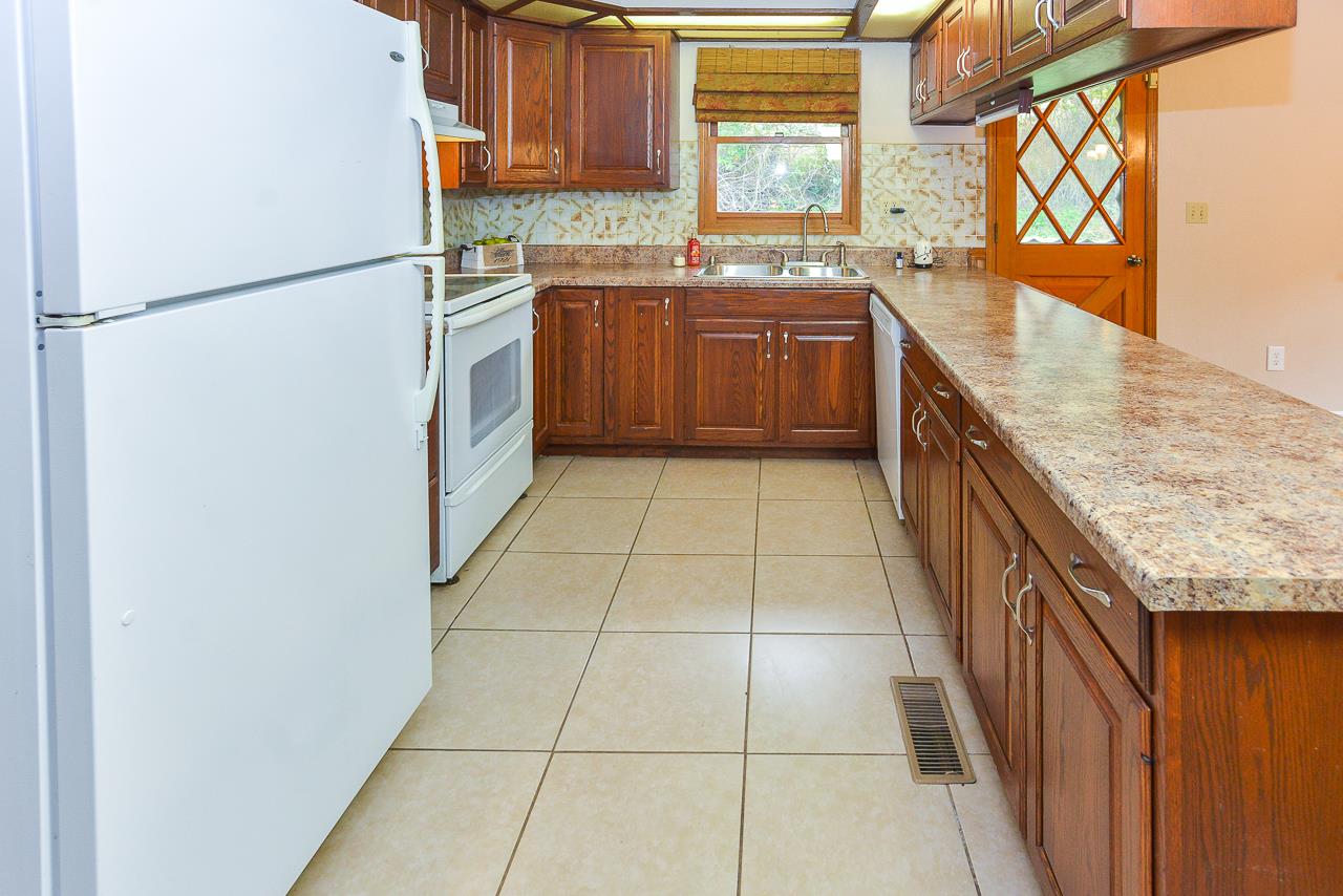 68 Taylor Road Mulberry, TN 37359 - Photo 10 of 24 a kitchen with stainless steel appliances granite countertop a refrigerator a sink and a stove