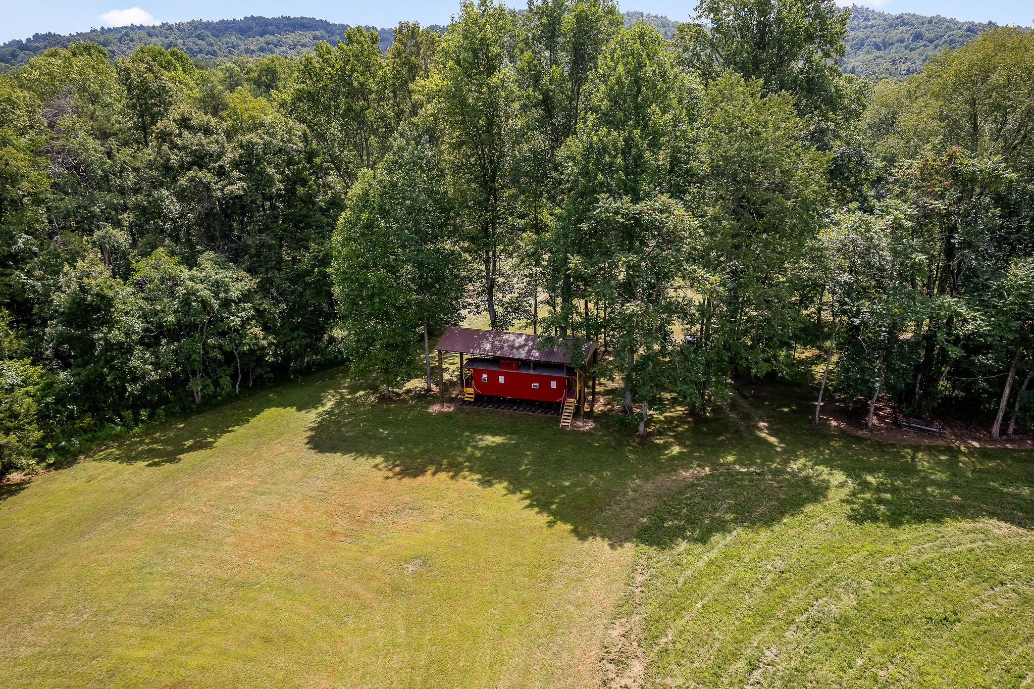 2641 Stamps Shady Grove Road Monterey, TN 38574 - Photo 5 of 70 a swimming pool with trees in the background