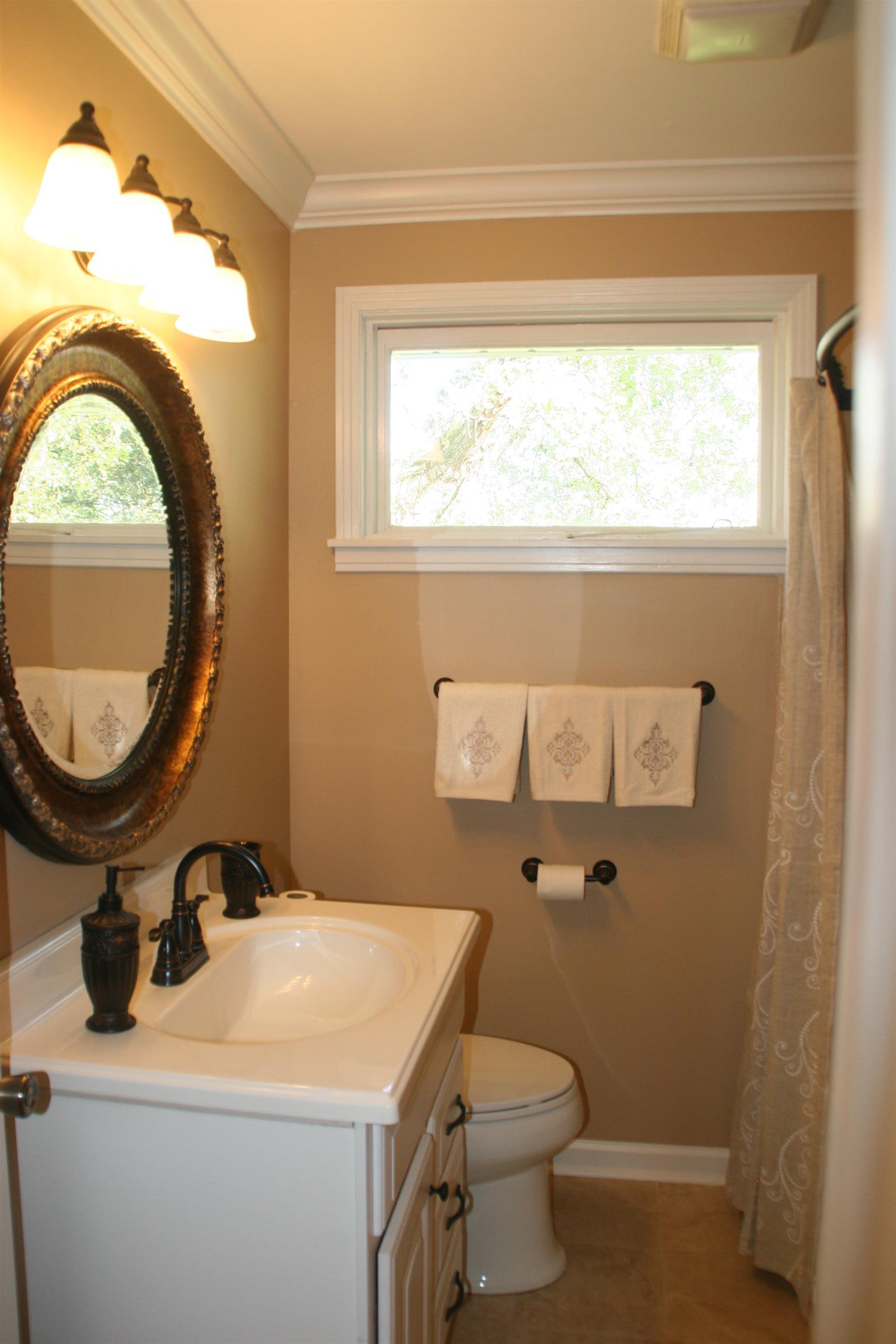 502 High Point Road Clarksville, TN 37042 - Photo 22 of 30 The Guest Bath WILL Delight You, too! It Features a Tile Surround, Tile Floors & the Prettiest Mirror In Town!