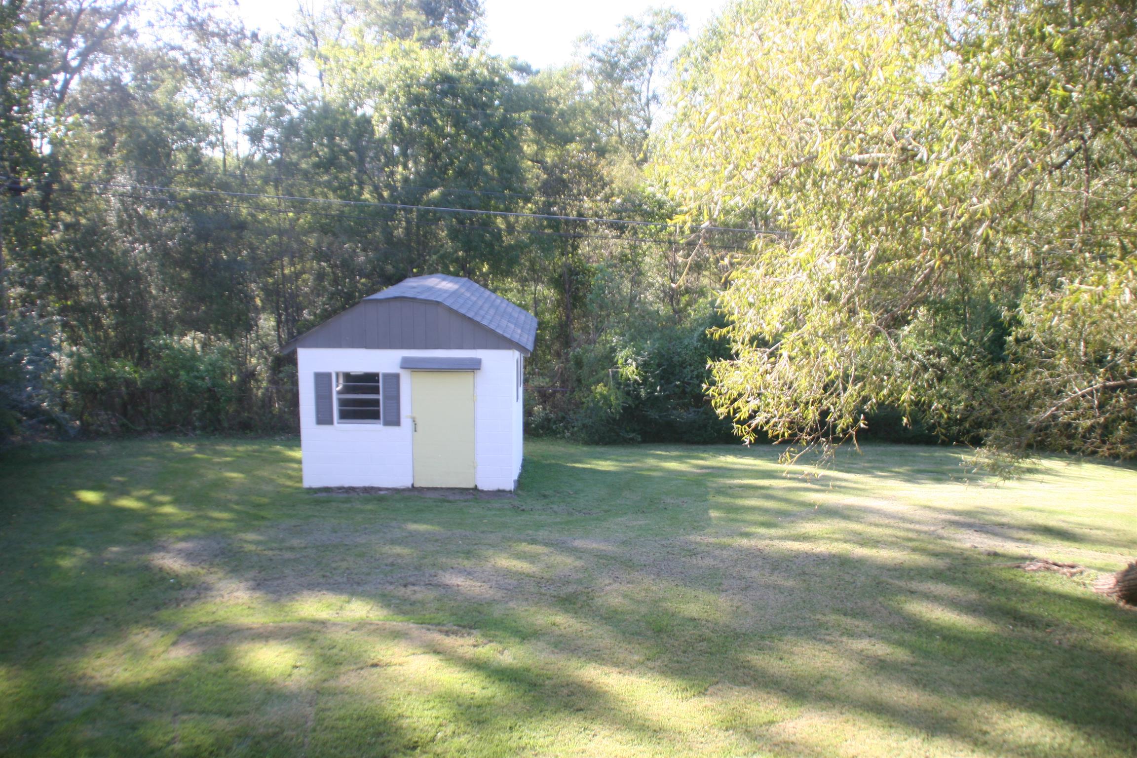 502 High Point Road Clarksville, TN 37042 - Photo 6 of 30 The Back Yard Boasts a Handy Workshop to Match the House, Complete with a Concrete FLoor, Electricity, New Roof & Matching Front Door.