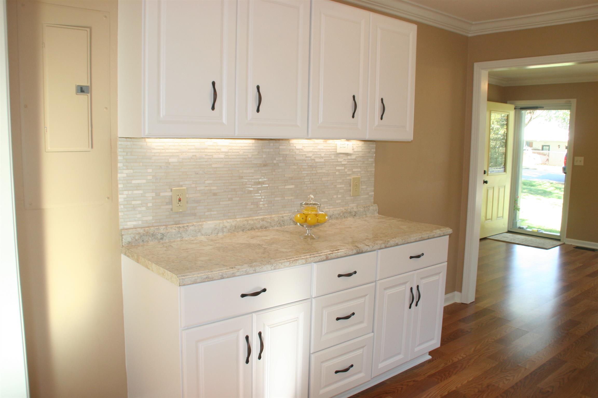 502 High Point Road Clarksville, TN 37042 - Photo 10 of 30 The Kitchen is Brand New & Features New Cabinets, Countertops, Backsplash & Lighting under the Cabinets.