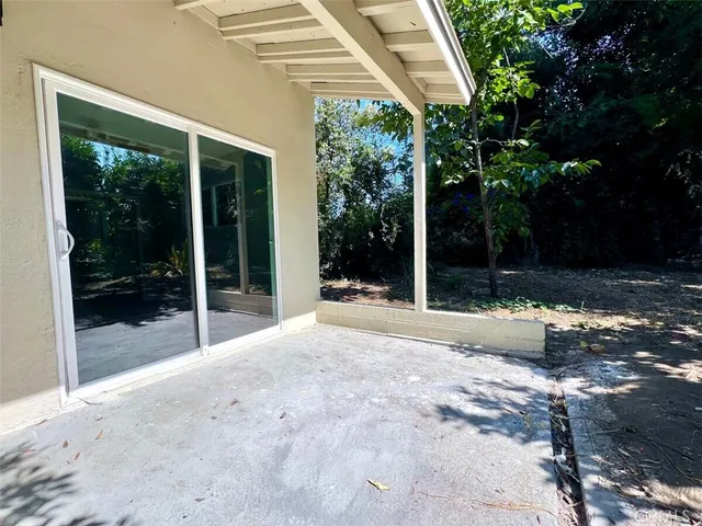 a view of backyard with green space