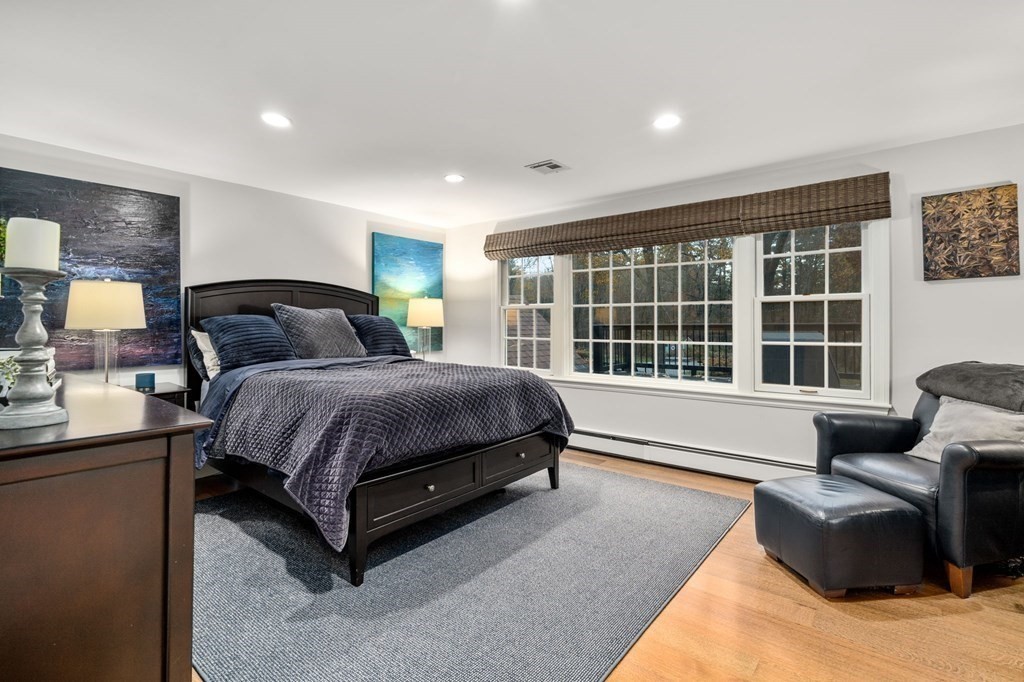 18 Audubon Road Wayland, MA 01778 - Photo 29 of 41 a bedroom with a bed and glass window