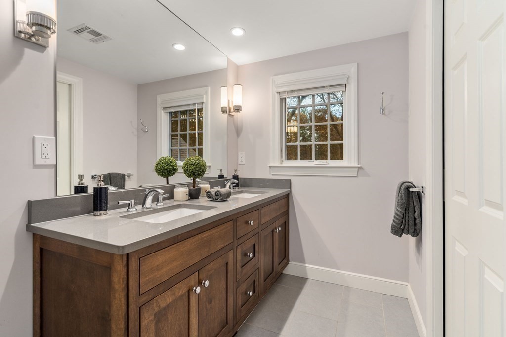 18 Audubon Road Wayland, MA 01778 - Photo 30 of 41 a bathroom with a sink and a mirror