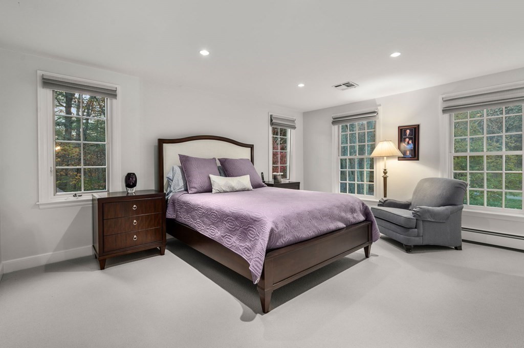 18 Audubon Road Wayland, MA 01778 - Photo 32 of 41 a bedroom with a bed and a couch with window