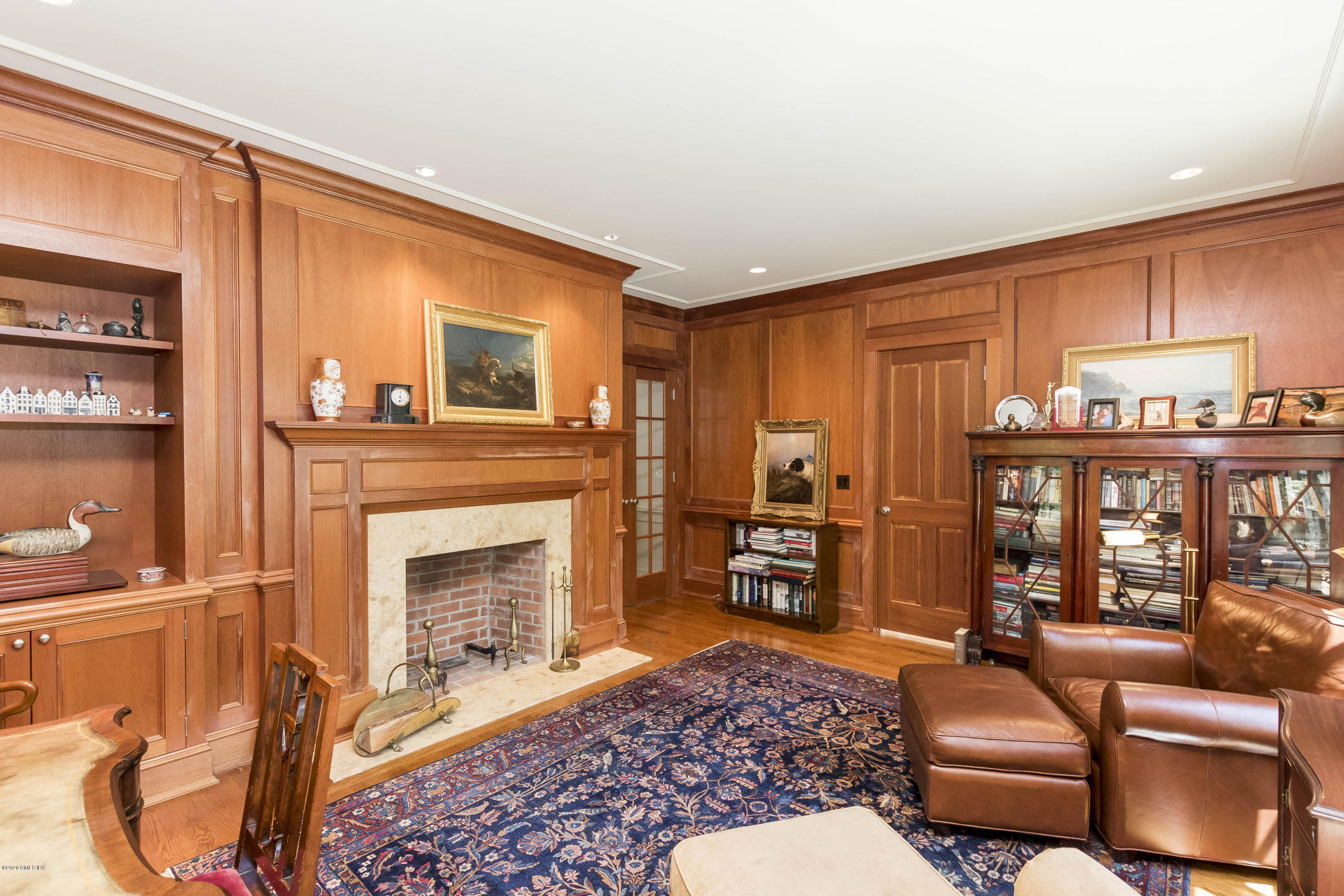 8 Hockanum Road Westport, CT 06880 - Photo 13 of 41 a living room with furniture a fireplace and a large window