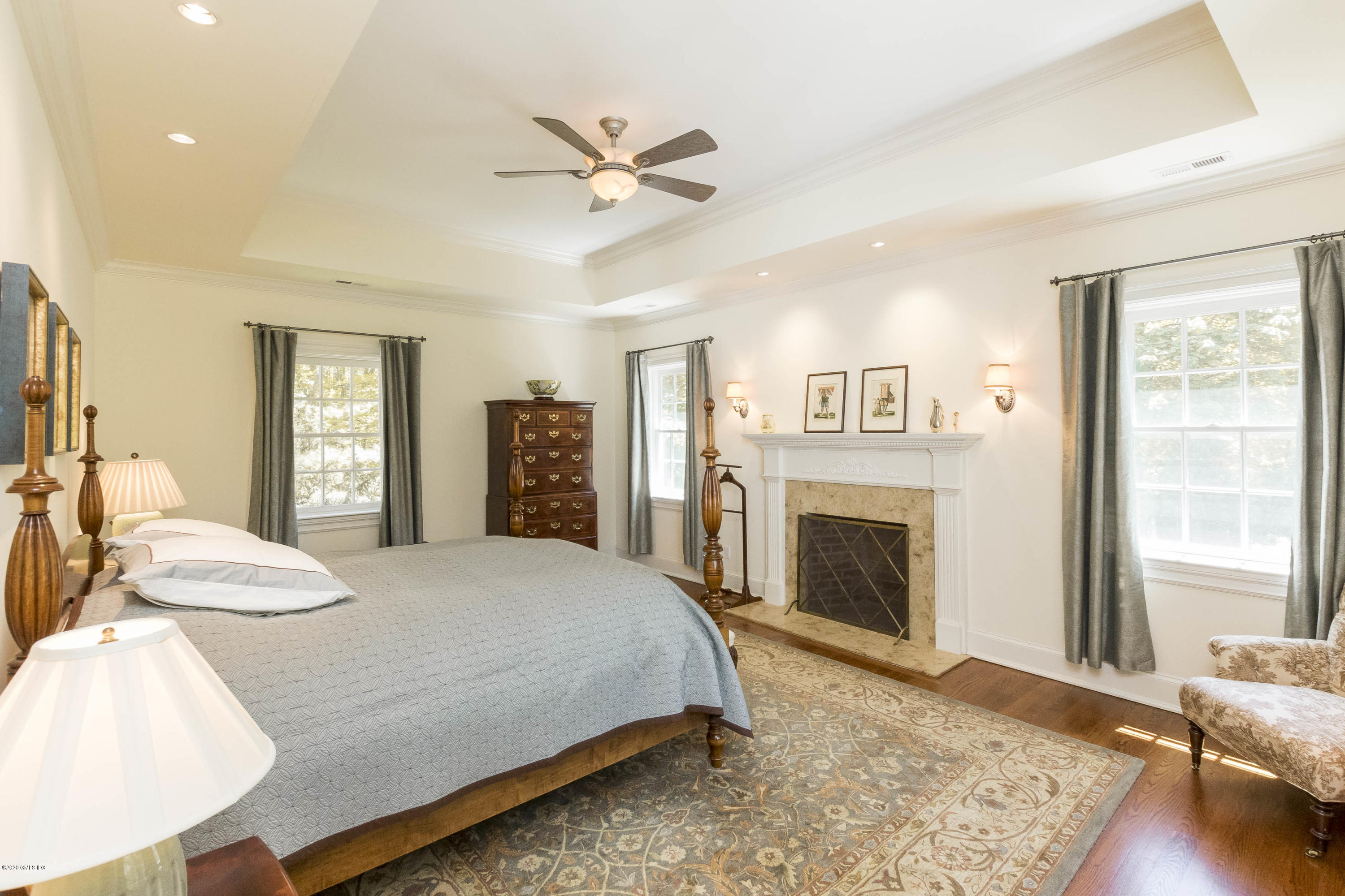 8 Hockanum Road Westport, CT 06880 - Photo 18 of 41 a spacious bedroom with a large bed and a fireplace