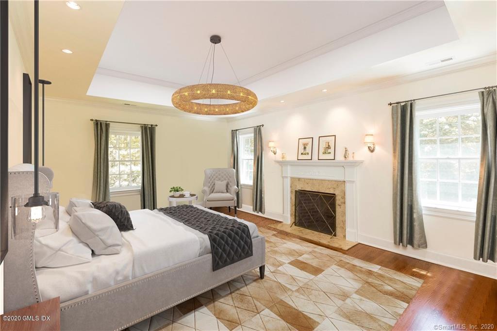8 Hockanum Road Westport, CT 06880 - Photo 19 of 41 a spacious bedroom with a large bed and a fireplace