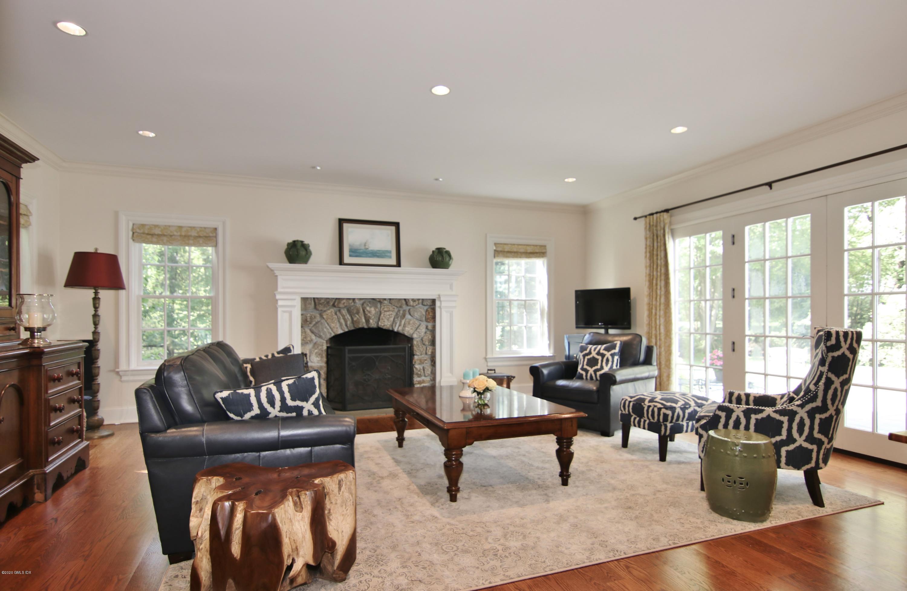 8 Hockanum Road Westport, CT 06880 - Photo 2 of 41 a living room with furniture fireplace and a large window