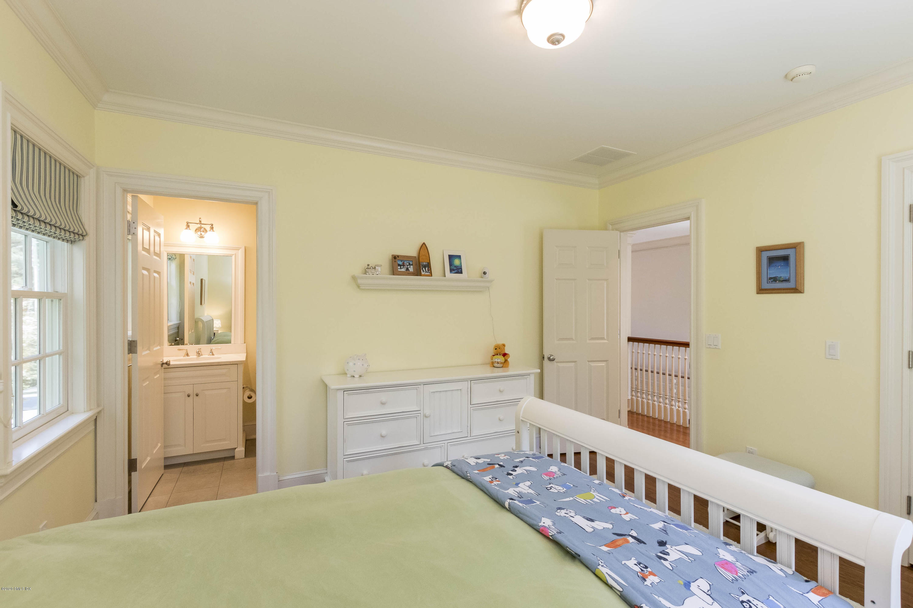 8 Hockanum Road Westport, CT 06880 - Photo 26 of 41 a bedroom with furniture and a baby crib
