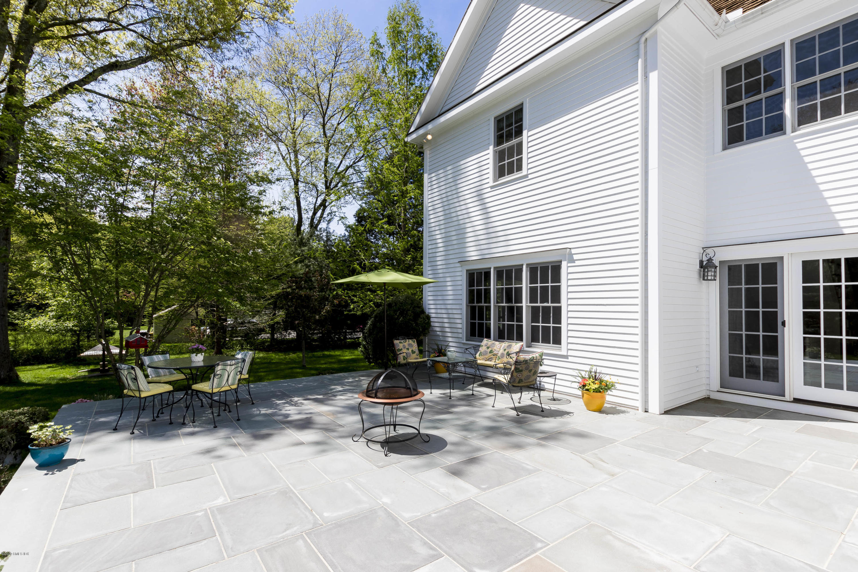 8 Hockanum Road Westport, CT 06880 - Photo 33 of 41 a front view of a house with sitting area and garden