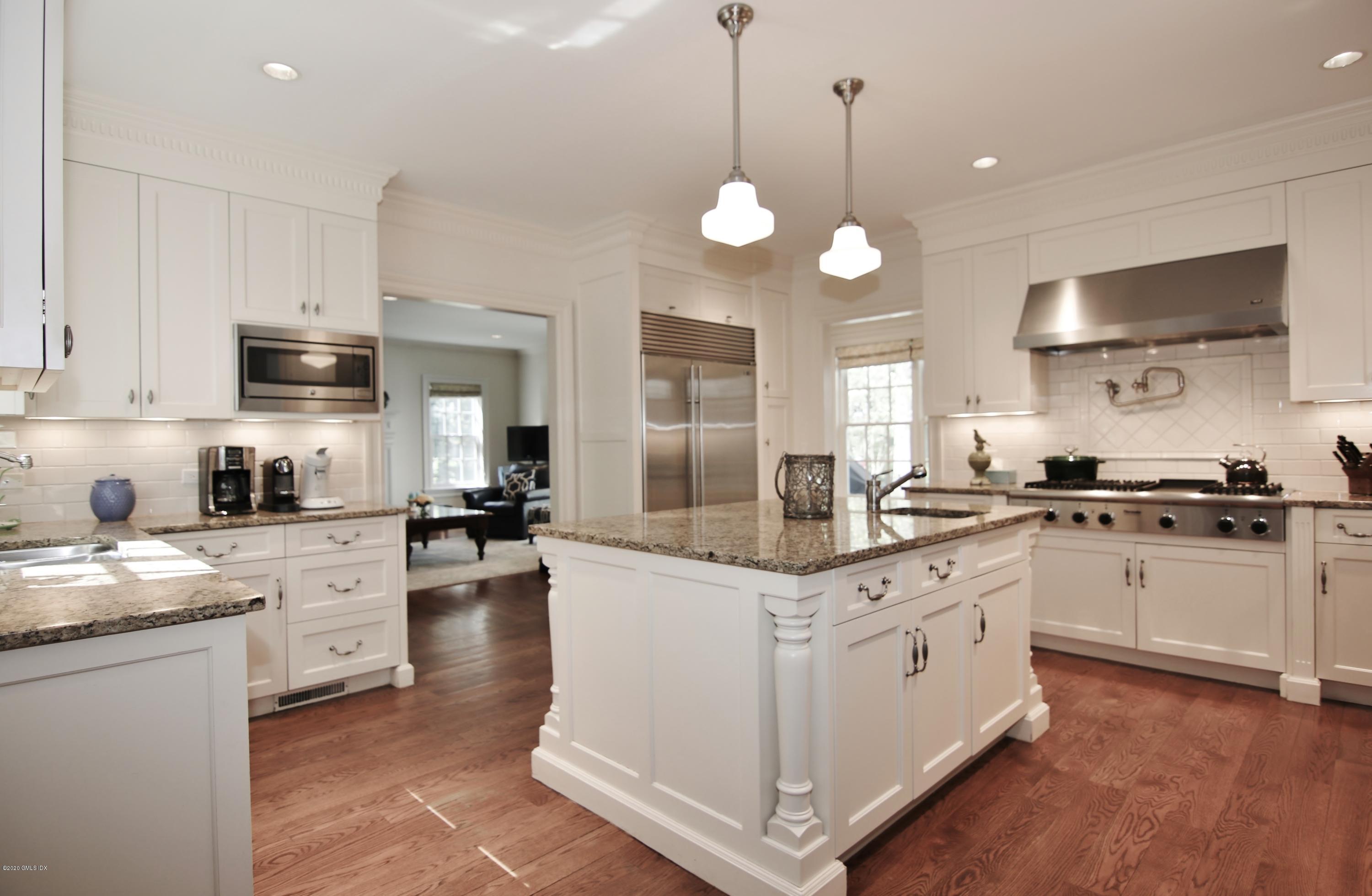 8 Hockanum Road Westport, CT 06880 - Photo 5 of 41 a kitchen with cabinets a center island and stainless steel appliances