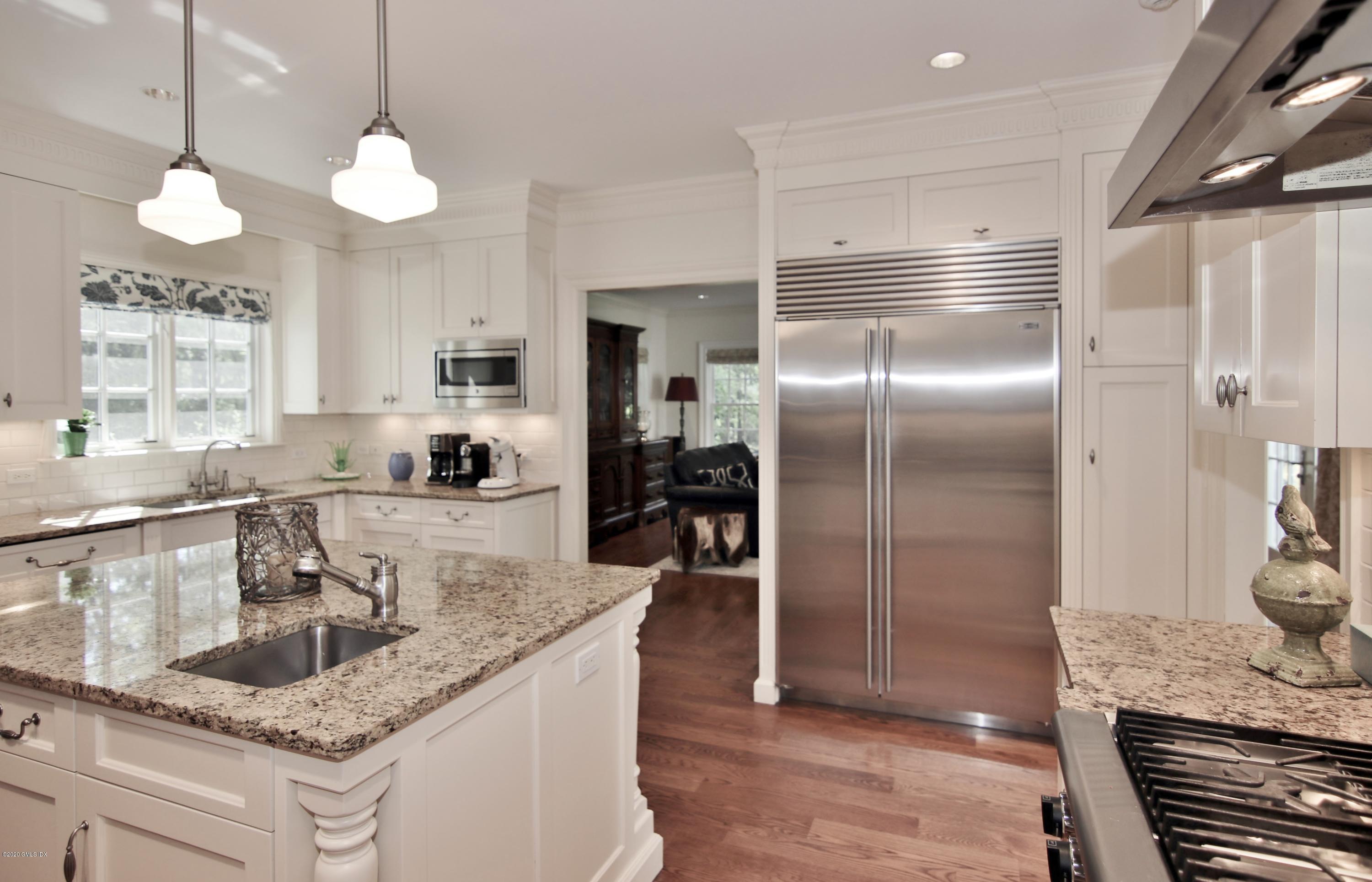 8 Hockanum Road Westport, CT 06880 - Photo 6 of 41 a kitchen with stainless steel appliances granite countertop a sink a refrigerator and a granite counter tops