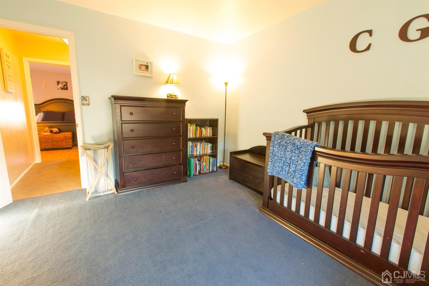 59 La Rue Lane East Brunswick, NJ 08816 - Photo 11 of 18 a view of a bedroom with furniture and window