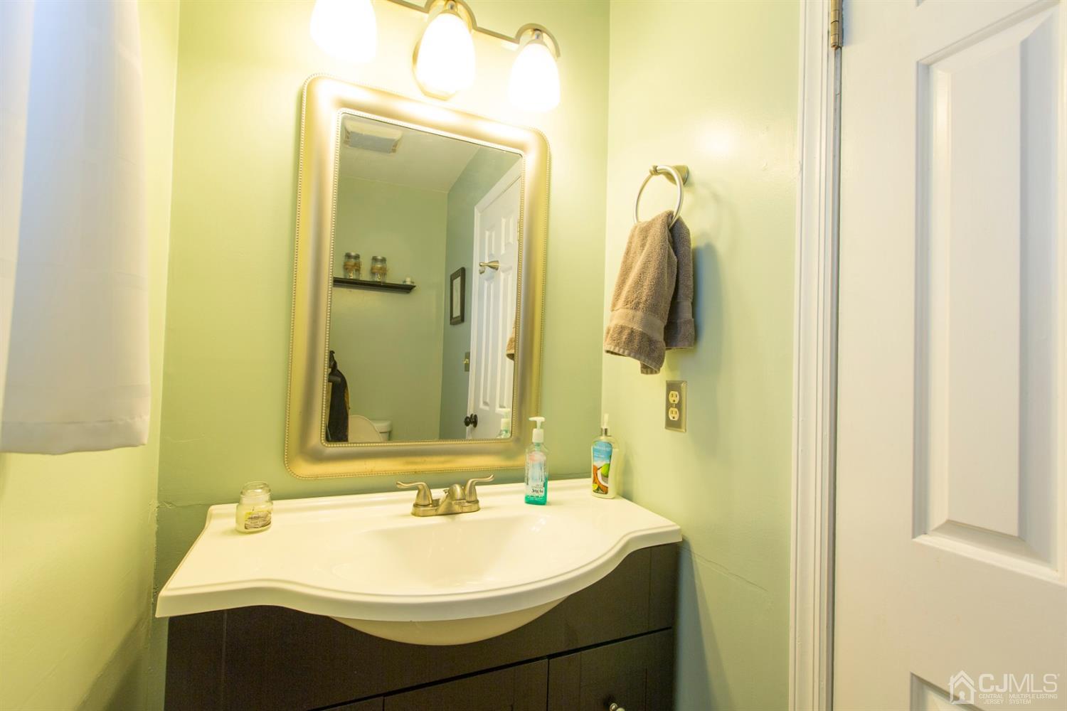 59 La Rue Lane East Brunswick, NJ 08816 - Photo 17 of 18 a bathroom with a sink and a mirror