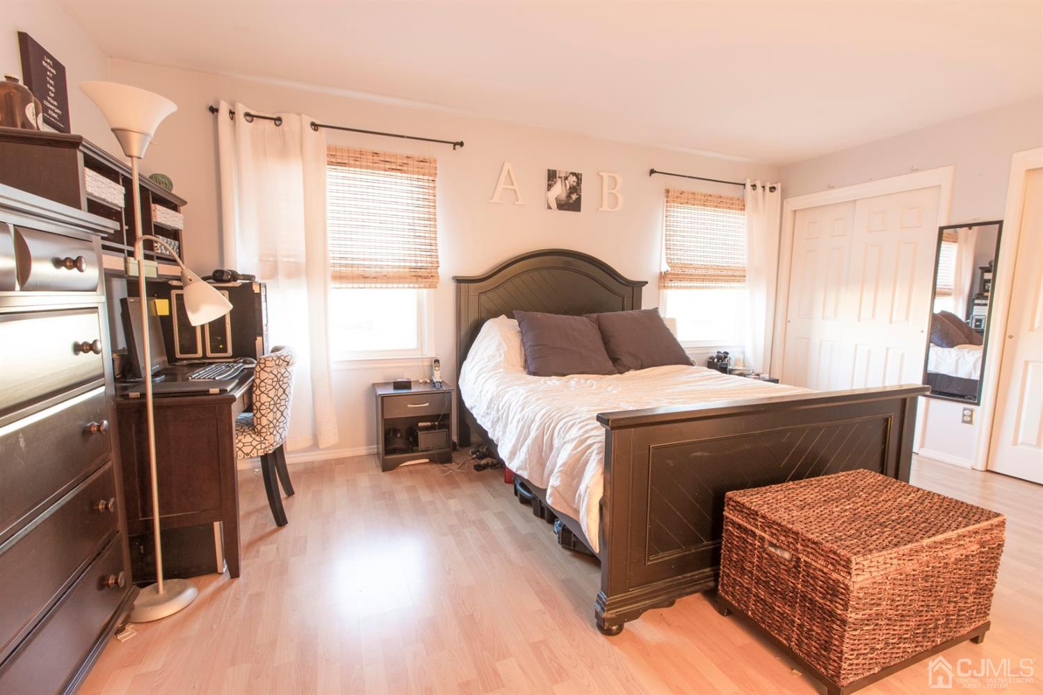 59 La Rue Lane East Brunswick, NJ 08816 - Photo 7 of 18 a bedroom with a bed and wooden floor