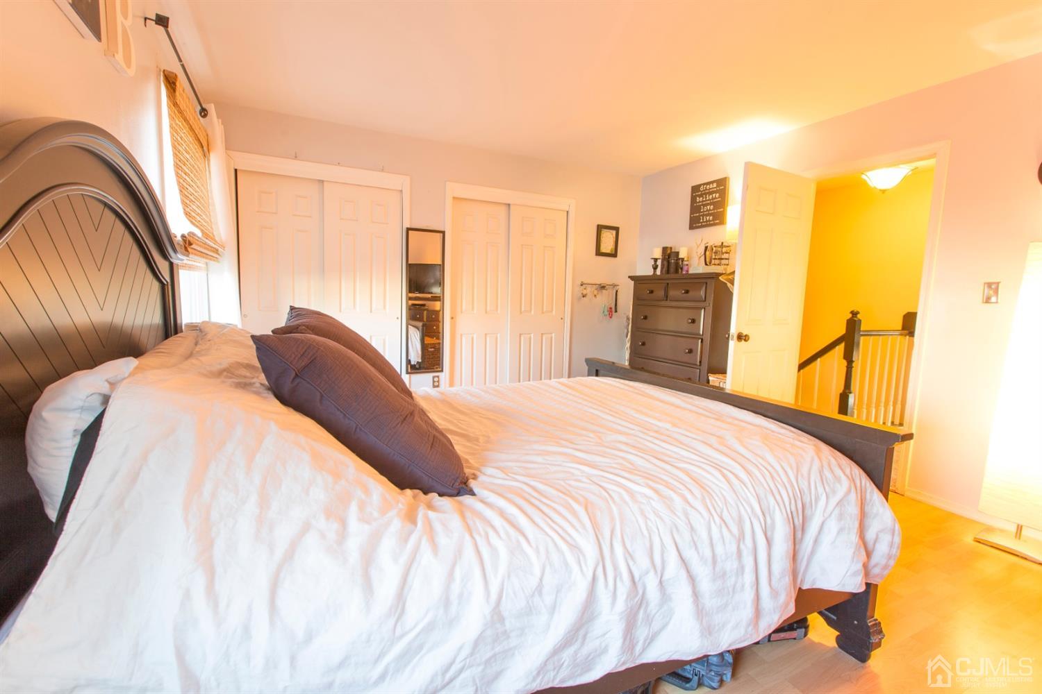 59 La Rue Lane East Brunswick, NJ 08816 - Photo 8 of 18 a bedroom with a bed and wooden floor