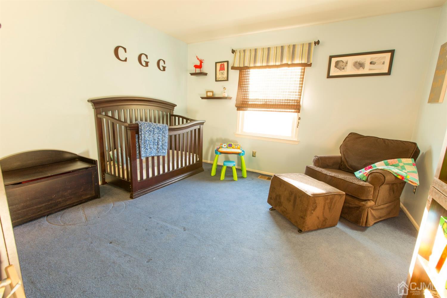 59 La Rue Lane East Brunswick, NJ 08816 - Photo 10 of 18 a bedroom with furniture and a window