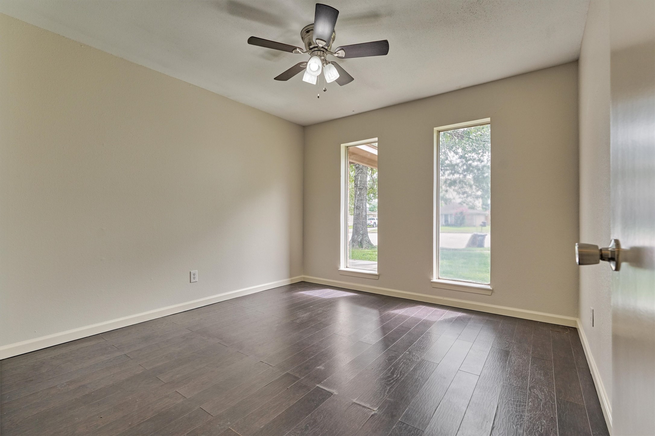 29318 Waltham Street Spring, TX 77386 - Photo 18 of 28 a view of an empty room with a window and wooden floor