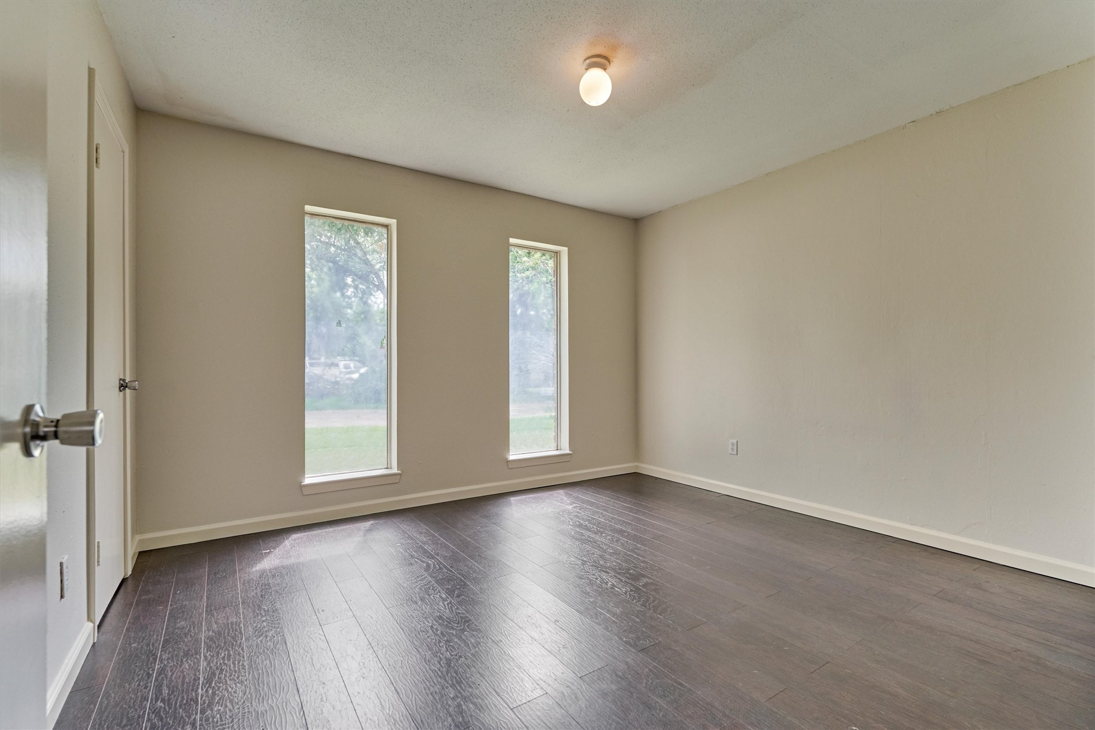 29318 Waltham Street Spring, TX 77386 - Photo 20 of 28 an empty room with wooden floor and windows