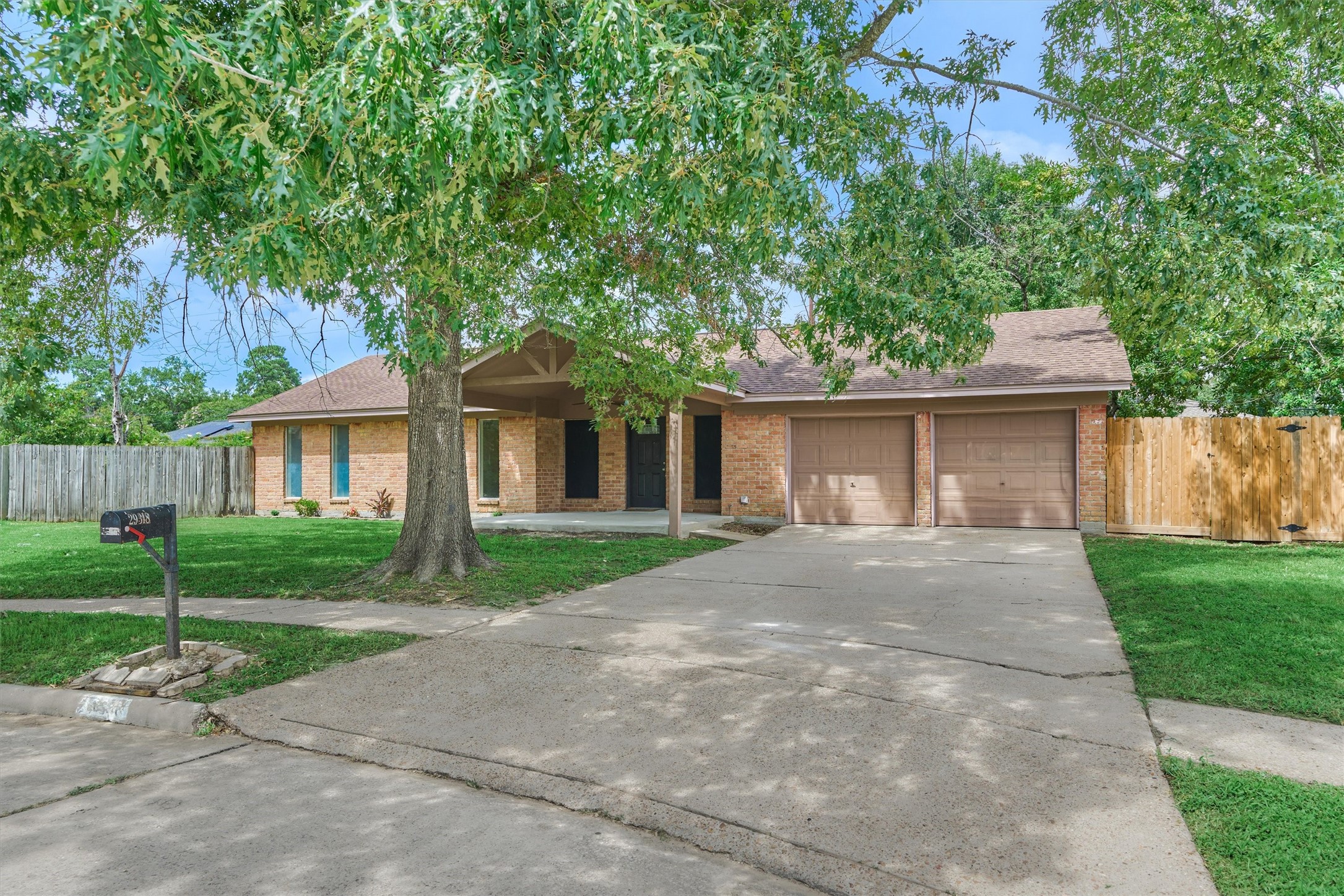 29318 Waltham Street Spring, TX 77386 - Photo 2 of 28 front view of a house and a yard