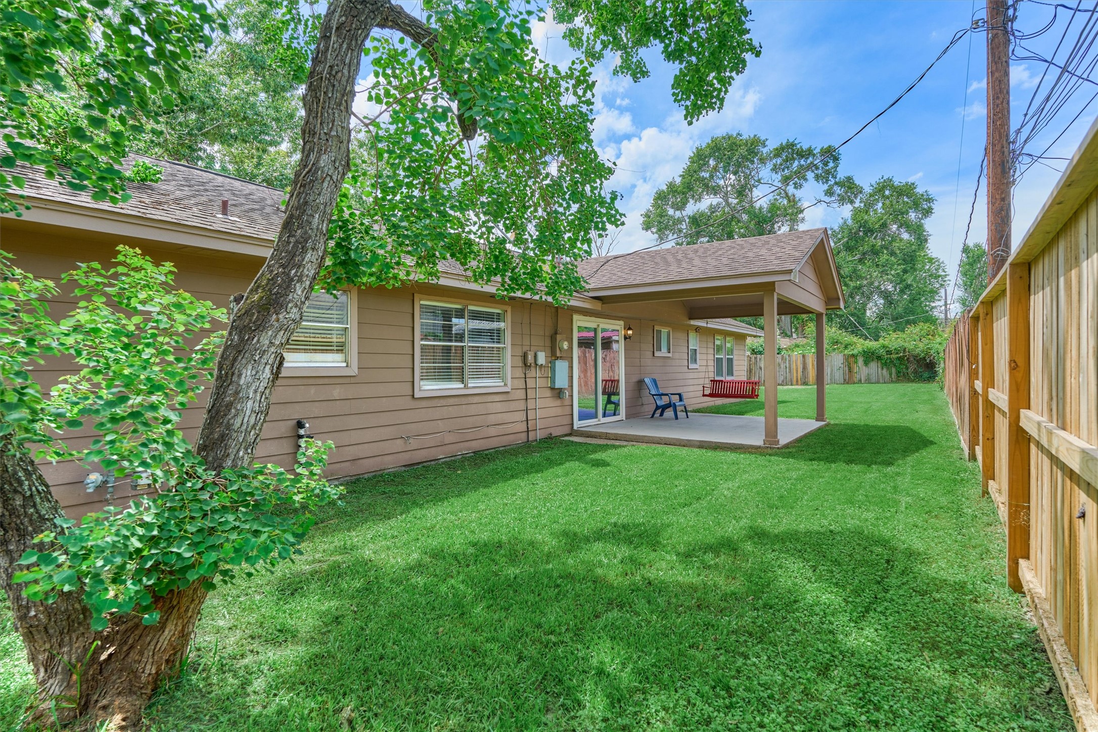 29318 Waltham Street Spring, TX 77386 - Photo 24 of 28 a view of a house with backyard and a hammock