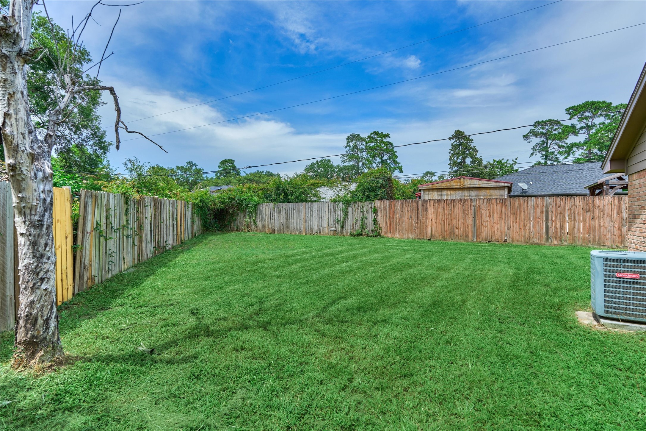 29318 Waltham Street Spring, TX 77386 - Photo 25 of 28 a view of a backyard with wooden fence