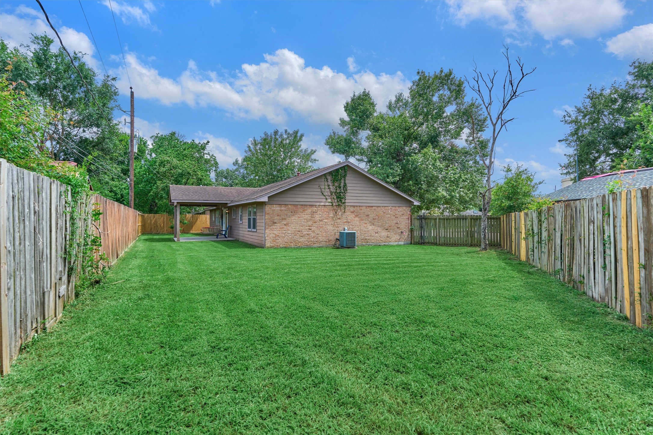 29318 Waltham Street Spring, TX 77386 - Photo 26 of 28 a view of a house with backyard and garden